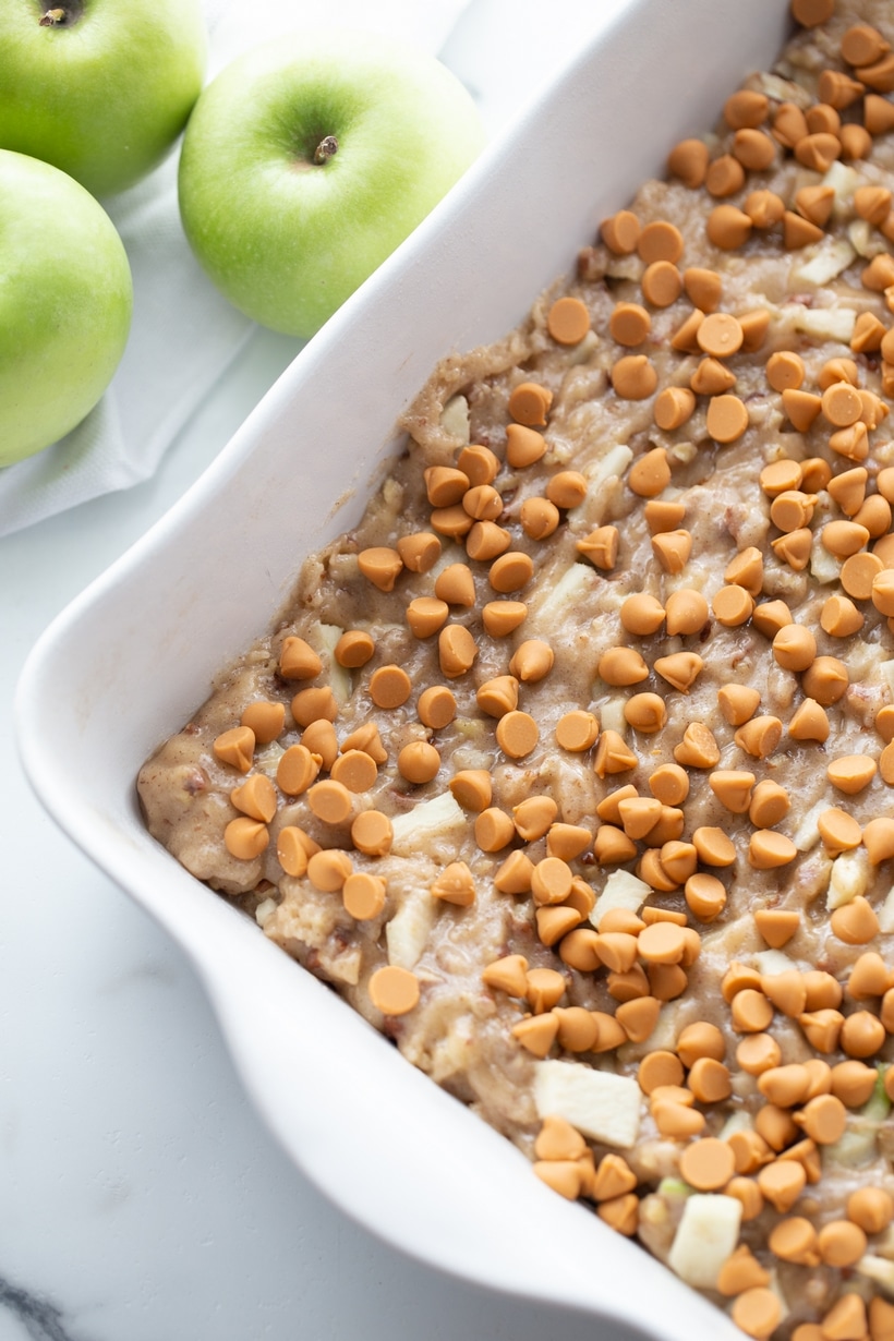 Butterscotch Apple Cake is light and airy, with fresh apple chunks and sweet butterscotch morsels baked into every bite. Finished with caramel and whipped cream, it adds a layer of decadence that completes the dessert perfectly. apple cake for fall