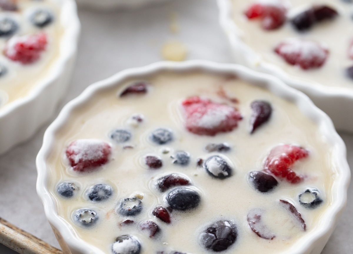 Enjoy the taste of summer with this mixed berry and cherry clafoutis. This dessert features ripe cherries and berries baked into a creamy custard. cherry clafoutis