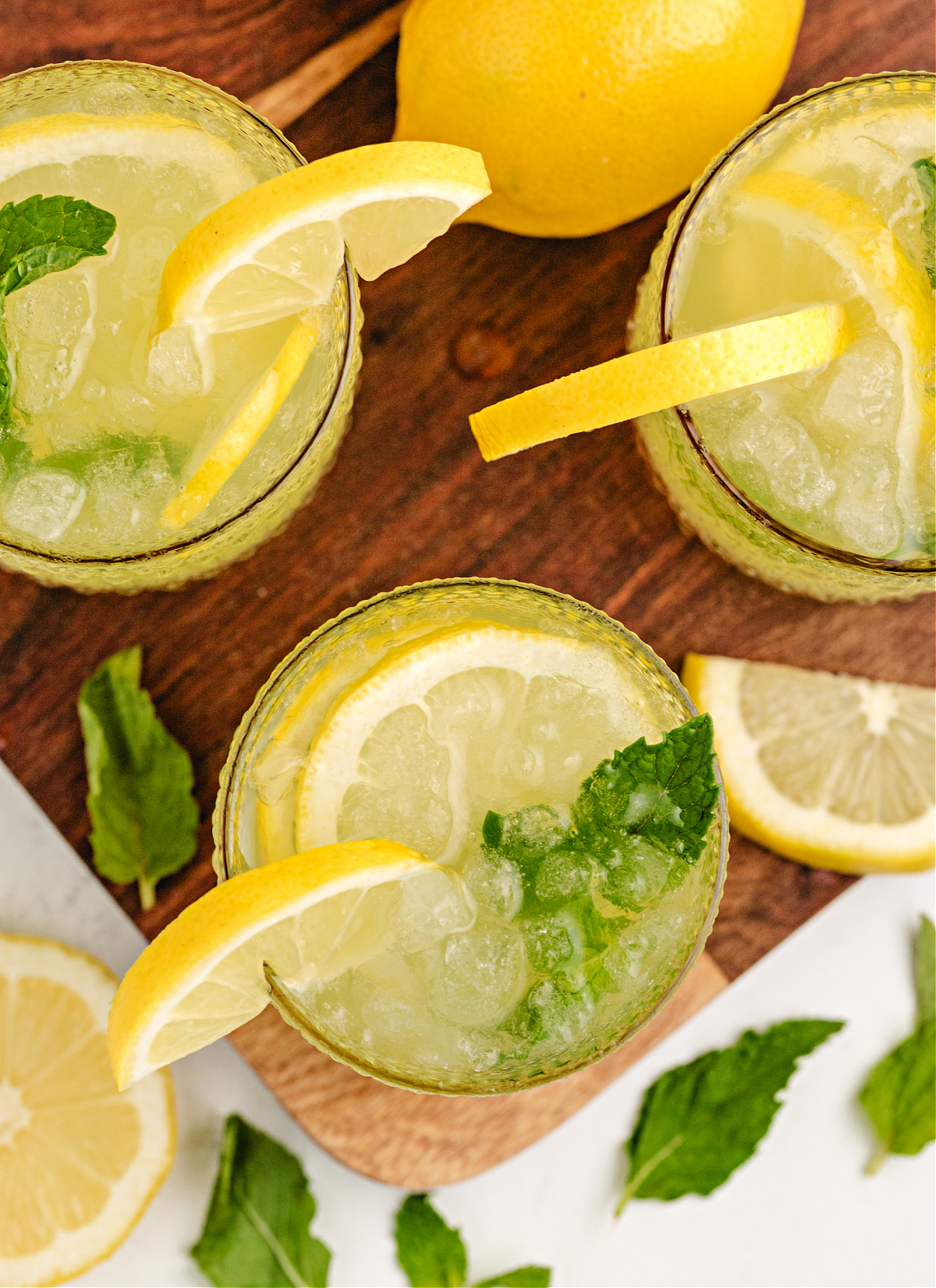 sparkling Italian-inspired lemonade cocktail Italian lemonade cocktail topped with Pellegrino, garnished with mint and lemon slices