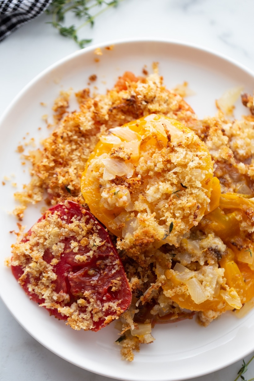 Discover the perfect way to enjoy ripe summer tomatoes with this flavorful tomato gratin. A delicious side dish that pairs well with any meal. Tomato Gratin