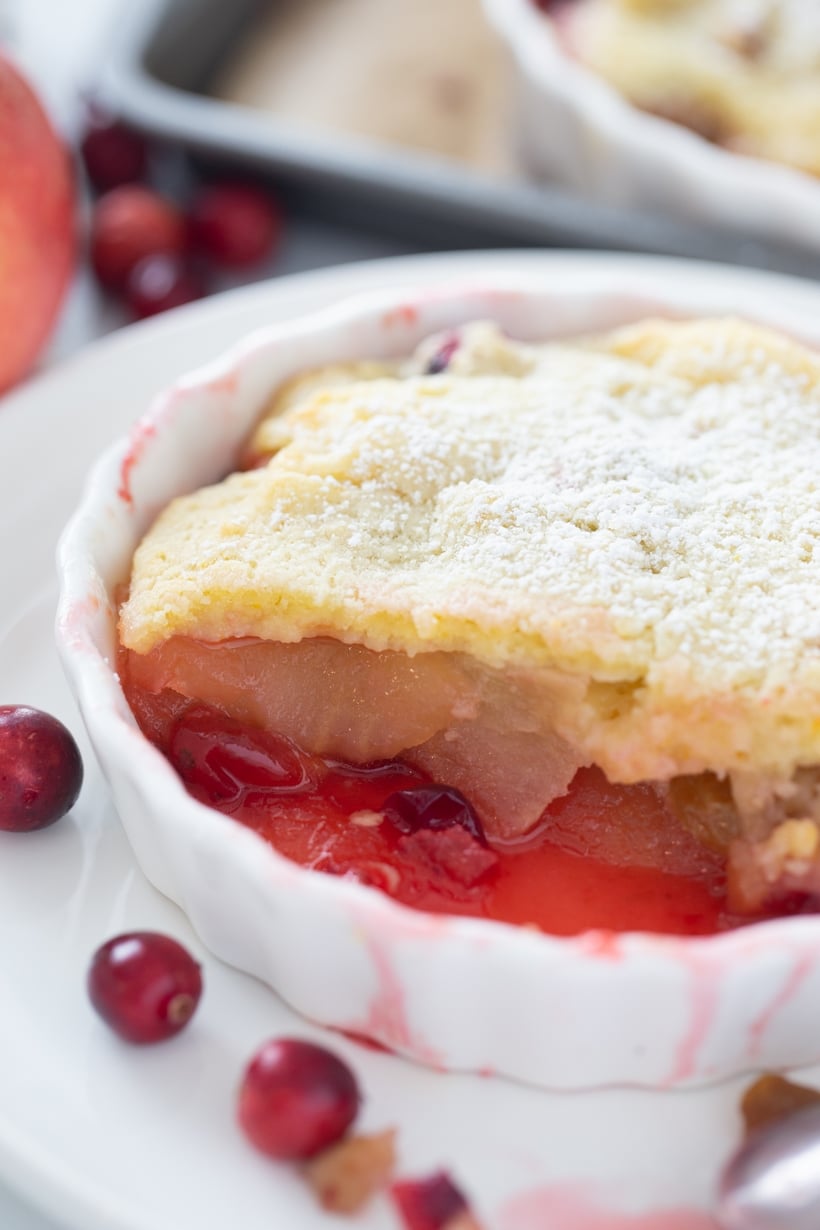 Top view of cranberry apple cobbler in an individual dish.