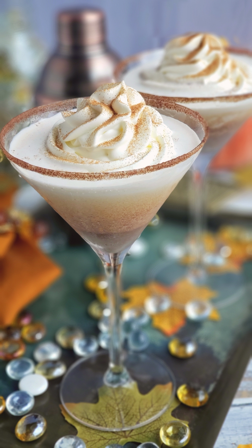 This Pumpkin Pie Martini recipe is a guaranteed hit of any holiday cocktail party. This made for Thanksgiving cocktail puts a whole new spin on what you should be drinking this fall. Two glasses of pumpkin pie martini.