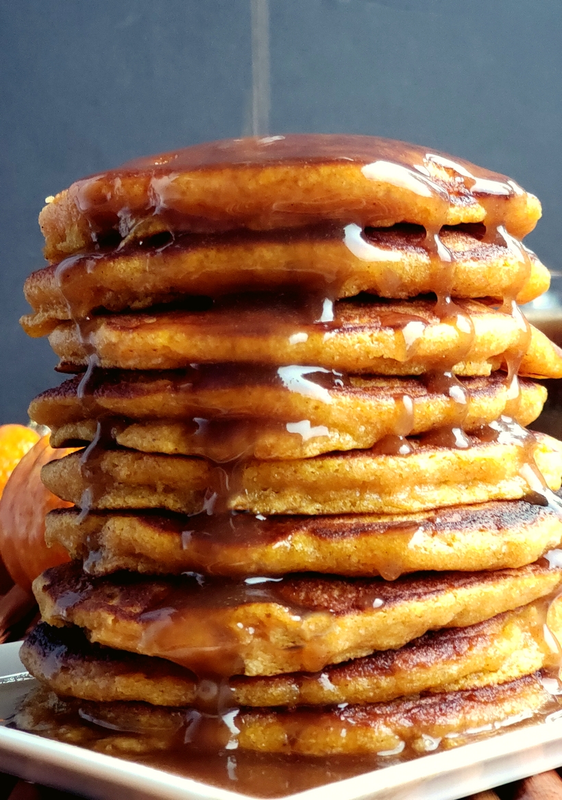 This Pumpkin Coffee Cake recipe tastes like fall. A cozy and generous mix of spices – cinnamon, ginger and nutmeg, along with a rich crumb topping make this coffee cake a perfect, seasonal treat. A stack of pumpkin pancakes.