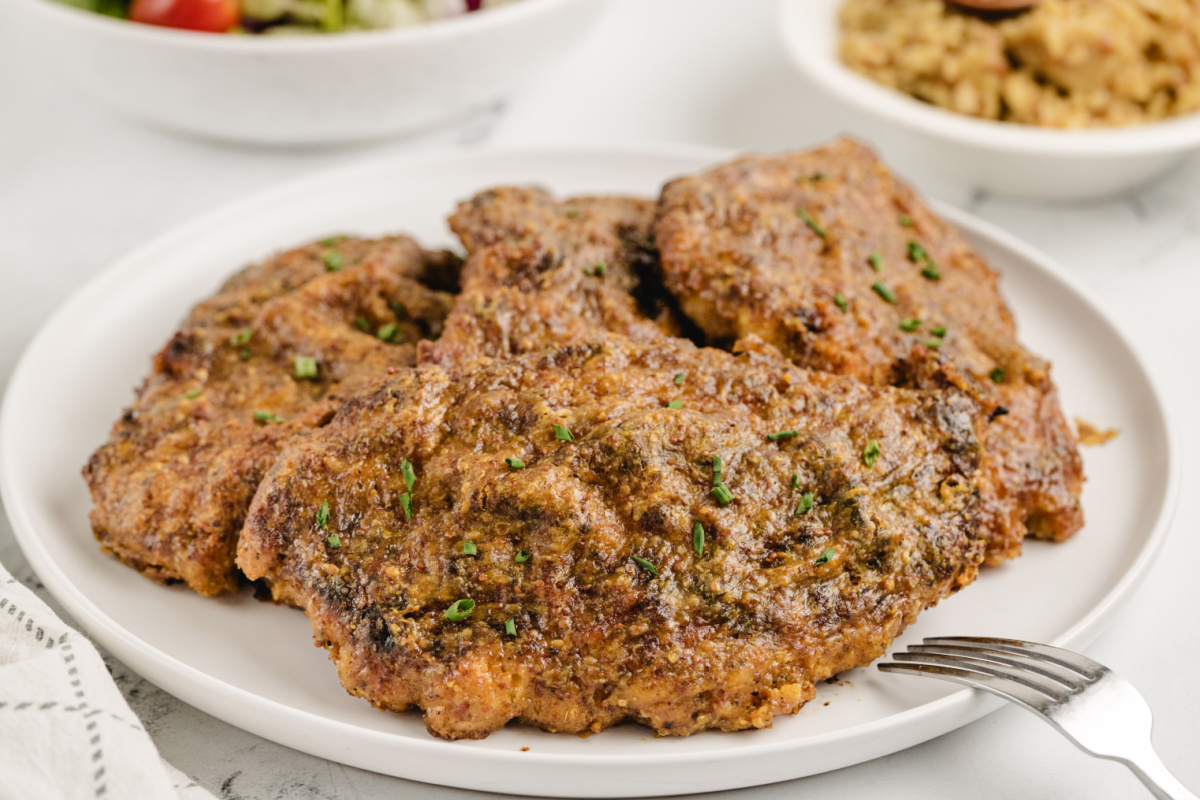 Weeknight Maple Mustard Chicken Dinner Plated chicken cutlet with golden crust, ready for a weeknight dinner