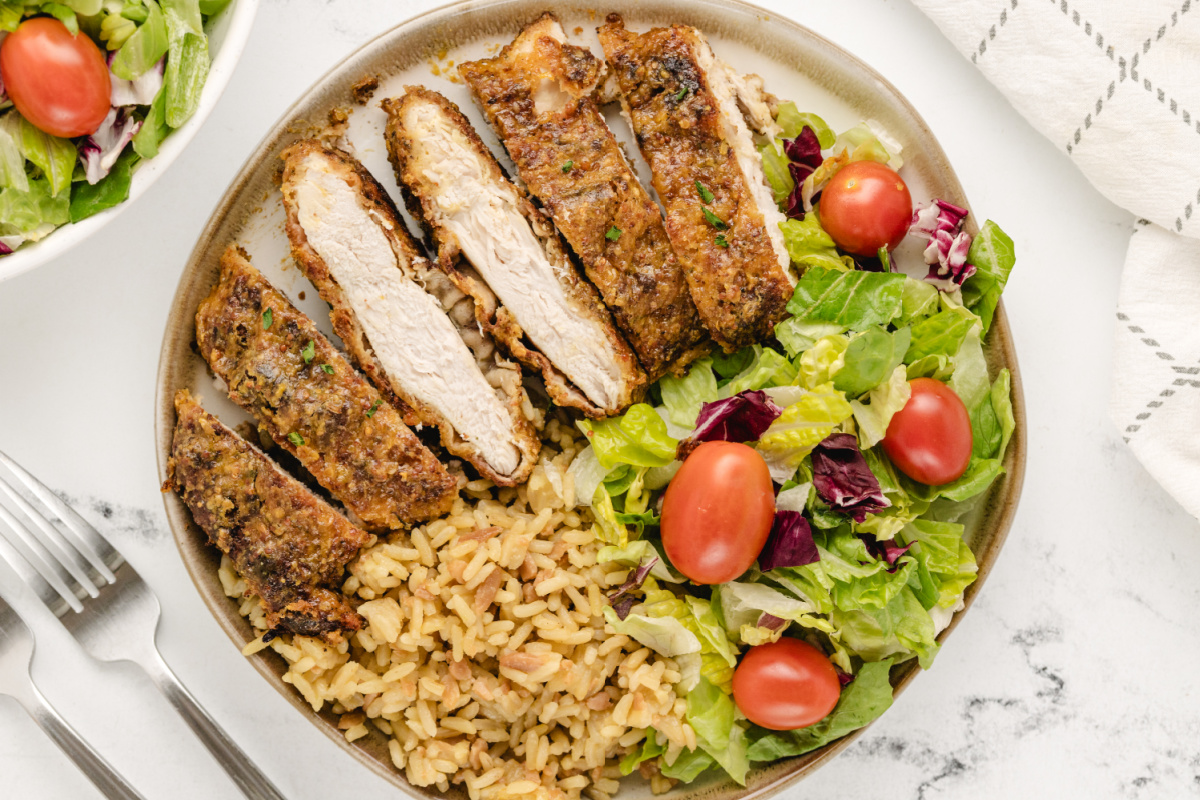 Maple Mustard Glazed Chicken Cutlets Fresh from the Oven Plate of crispy baked chicken cutlets coated in maple mustard glaze