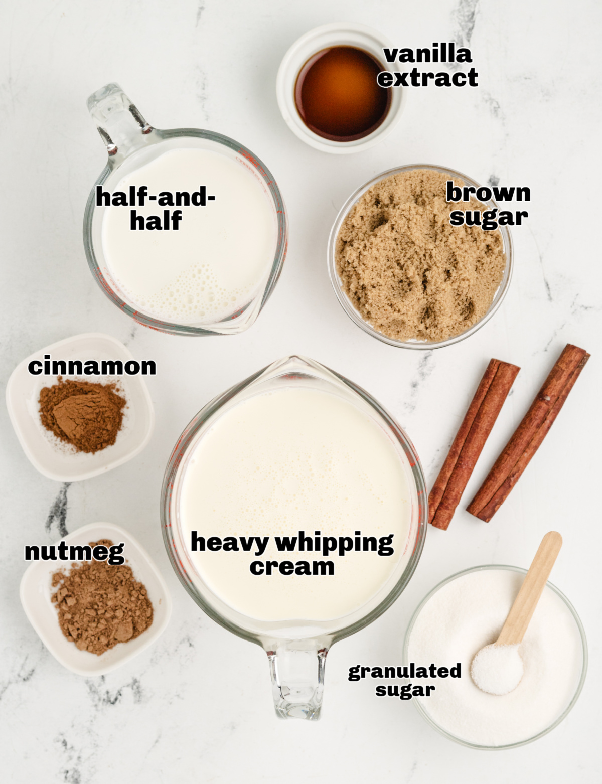 Ingredients for making snickerdoodle ice cream. Measured ingredients for snickerdoodle ice cream on a white surface.