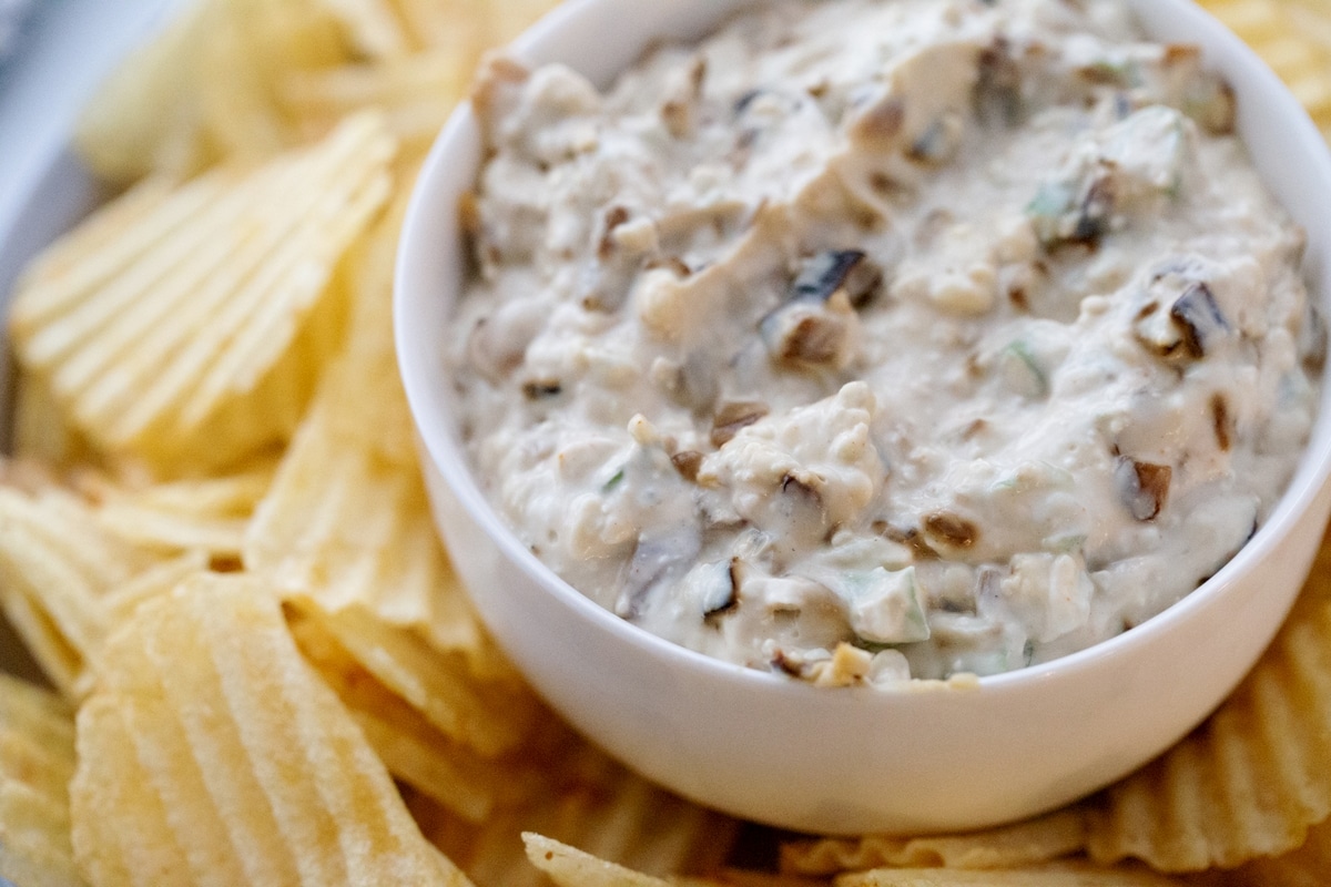 When you're ready to serve, enjoy this dip with potato chips or spread it generously on your favorite burger. onion dip with blue cheese