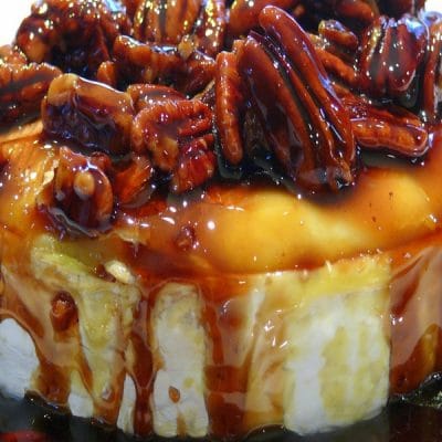 This Kahlua-Pecan-Brown Sugar Baked Brie is going to rock your next party, gathering or celebration. The brie comes out of the oven gooey and oozing and awaiting it’s sweet and delicious topping. It is a must make any time of the year. #noblepig #kahluapecanbrownsugarbakedbrie #kahluabakedbrie #brie #bakedbrie #holidayappetizer #holidayentertaining #easyholidayappetizer #appetizer #easyrecipe #quickappetizer #holidaypartyappetizer #christmasappetizer #holidayfun #holidayfood #kahlua