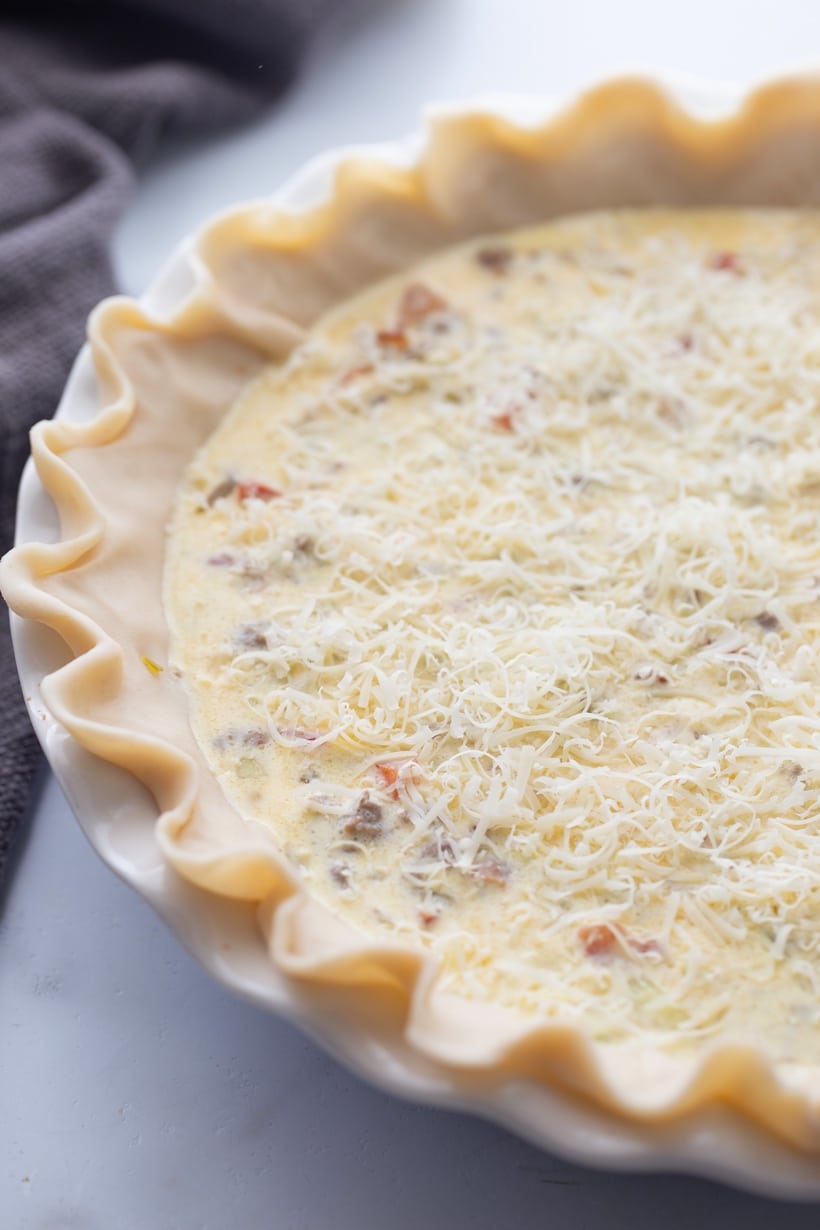 A Cheeseburger Quiche that tastes just like the hamburger you've been craving. Packed with ground beef protein and bacon, this quiche is the best! ground beef quiche crust before baking