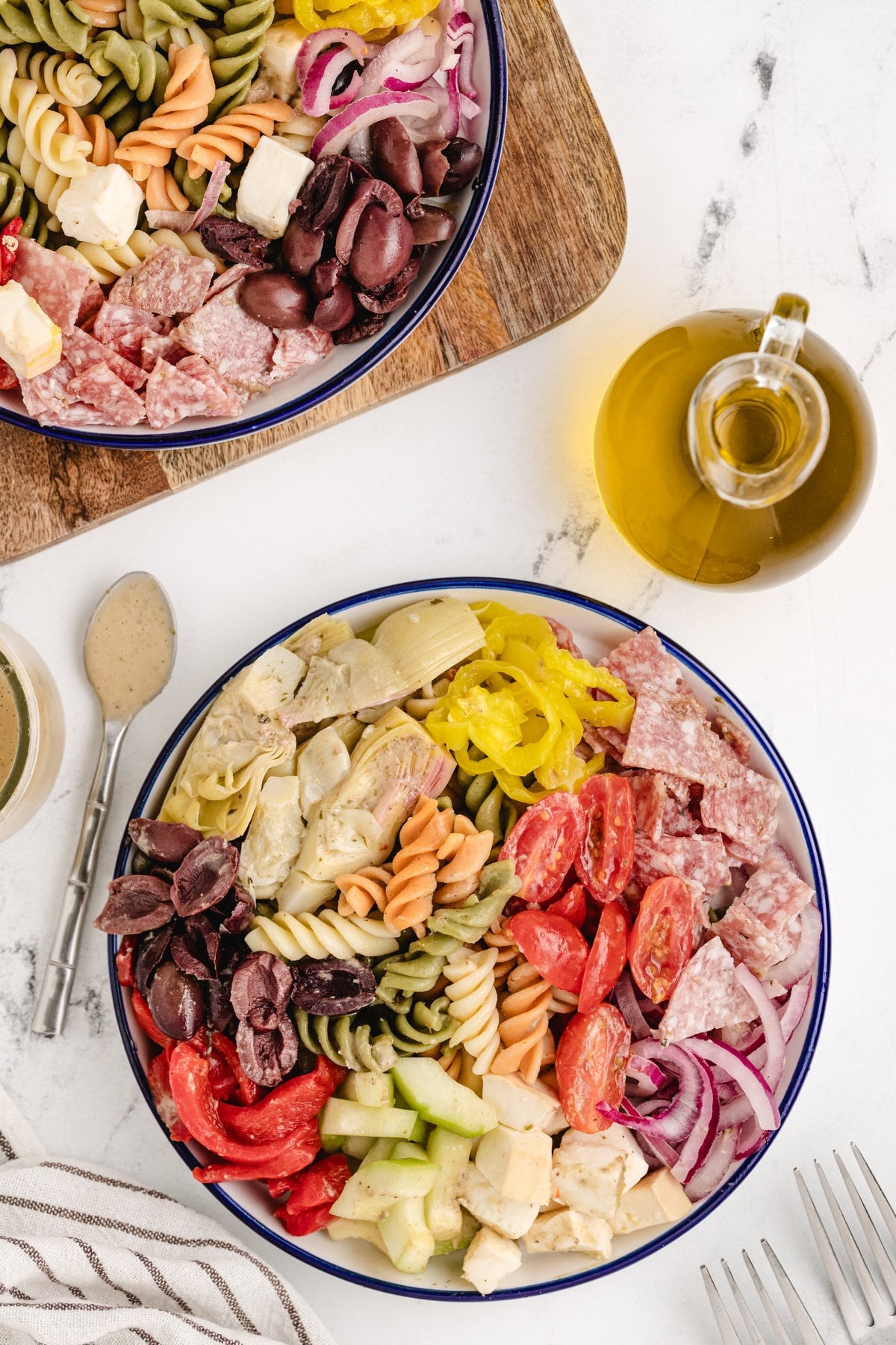Every bite of this antipasto pasta salad, with its tangy red wine vinaigrette, crunchy cucumbers, salami, Kalamata olives, and especially the smoked mozzarella, offers something different and tastes amazing. pasta salad with smoked mozzarella