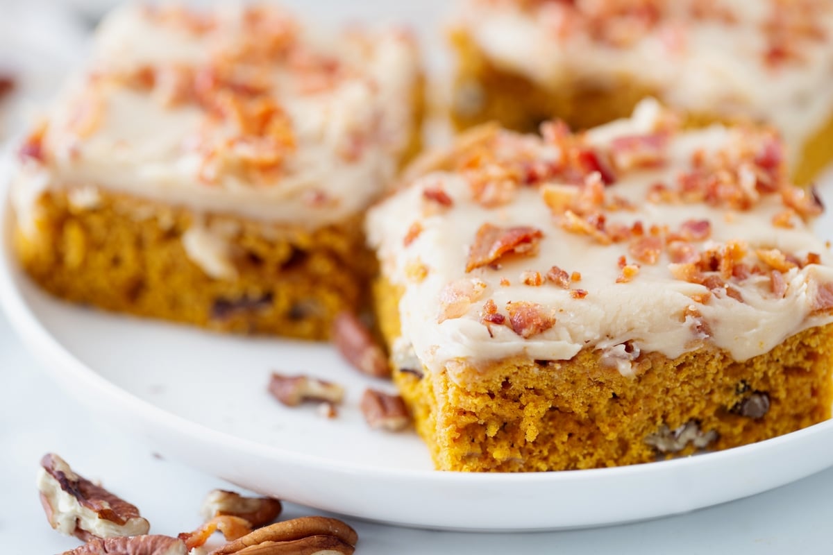 These pumpkin caramel bars are an unforgettable salty-sweet combo, with bacon on top for crunch and drippings in the pumpkin layer to pack in even more flavor. pumpkin caramel bars with bacon