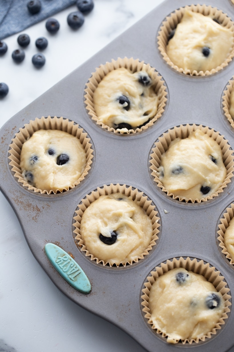 Sour Cream Blueberry Muffins ready to bake Sour cream blueberry muffins ready to bake in a muffin tin