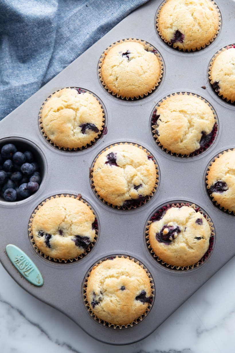 Sour Cream Blueberry Muffins baked and ready to eat. sour cream blueberry muffins baked in a muffin tin