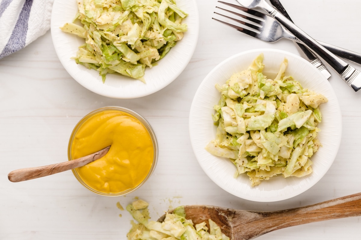 This Tennessee-Style Mustard Coleslaw is a classic with a twist, where yellow mustard adds an extra kick. It’s not just a great side; it’s perfect for piling on burgers or hot dogs, too. mustard based coleslaw