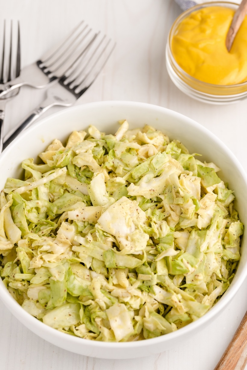 This Tennessee-Style Mustard Coleslaw is a classic mayonnaise-based coleslaw bolstered with the addition of yellow mustard. This traditionally, southern version of coleslaw is a versatile side dish that can do double duty as a burger or hot dog topper, too. mustard slaw