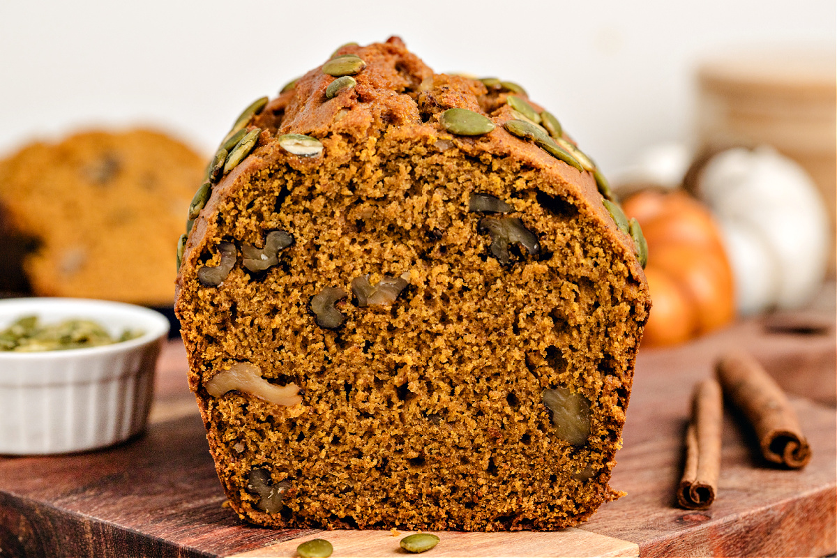 Lower calorie pumpkin bread with walnuts inside the loaf.