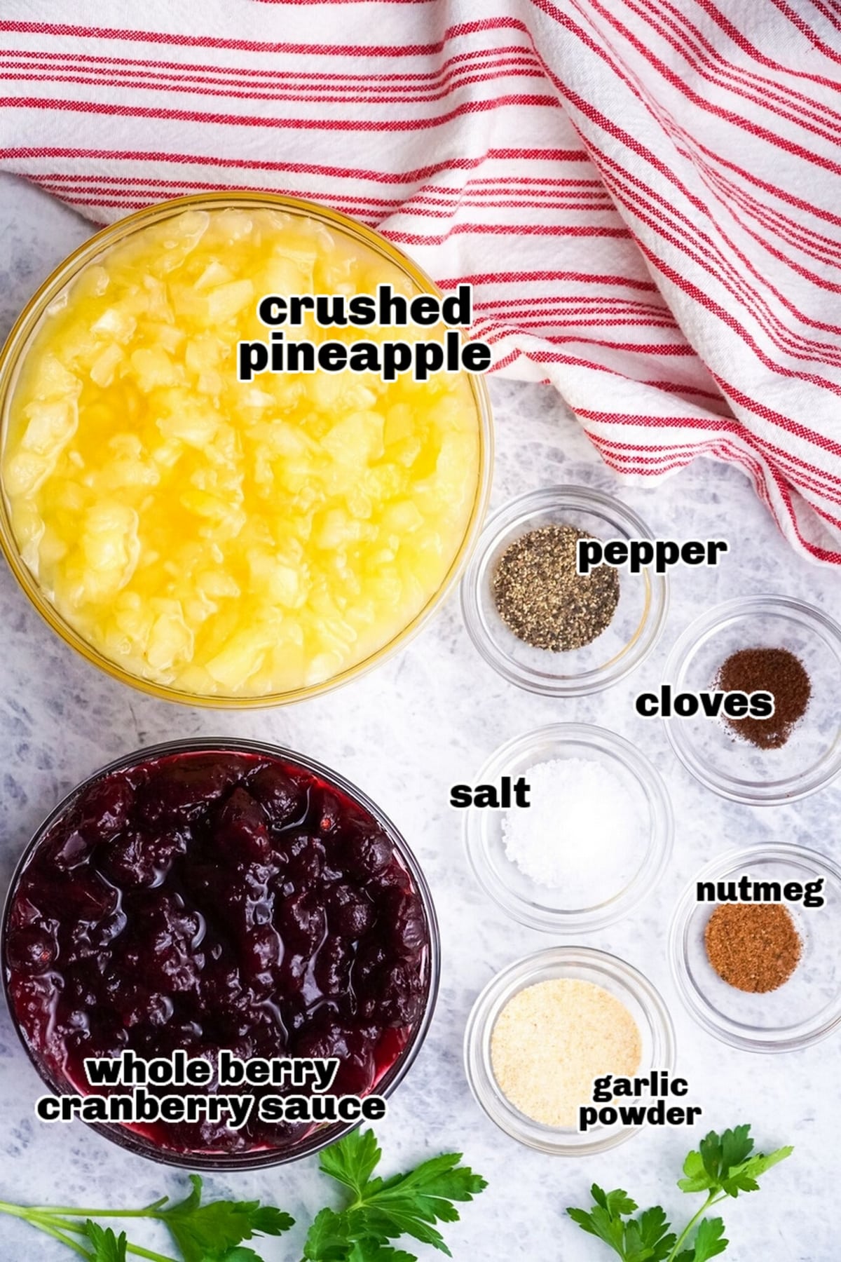 Ingredients for slow cooker pork recipe Ingredients for making pork, including pork loin, cranberry sauce, pineapple, and spices, arranged on a countertop.