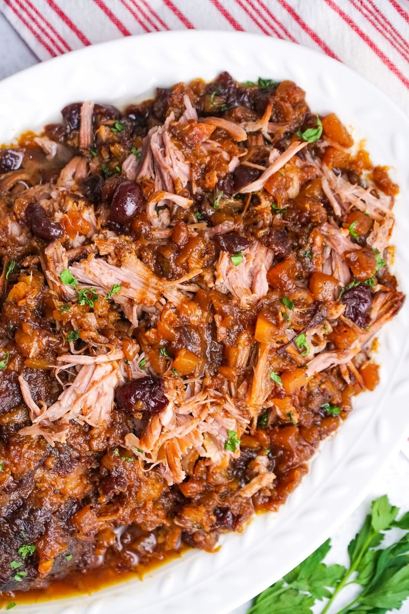 Close-up of tender pork with sauce. Detailed close-up of pork with cranberry-pineapple sauce on top.