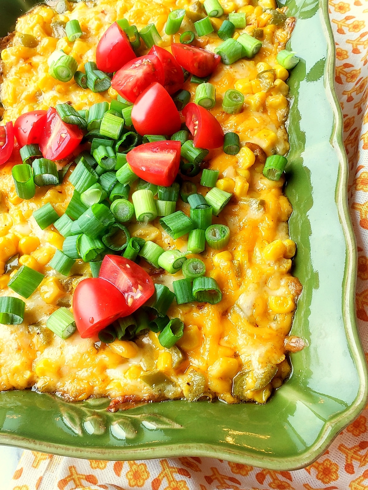 This hot corn dip, packed with lots of melty cheese, corn, and seasonings, disappears faster than any appetizer I’ve ever made. It's one of my favorites to serve at gatherings. cheese dip with corn