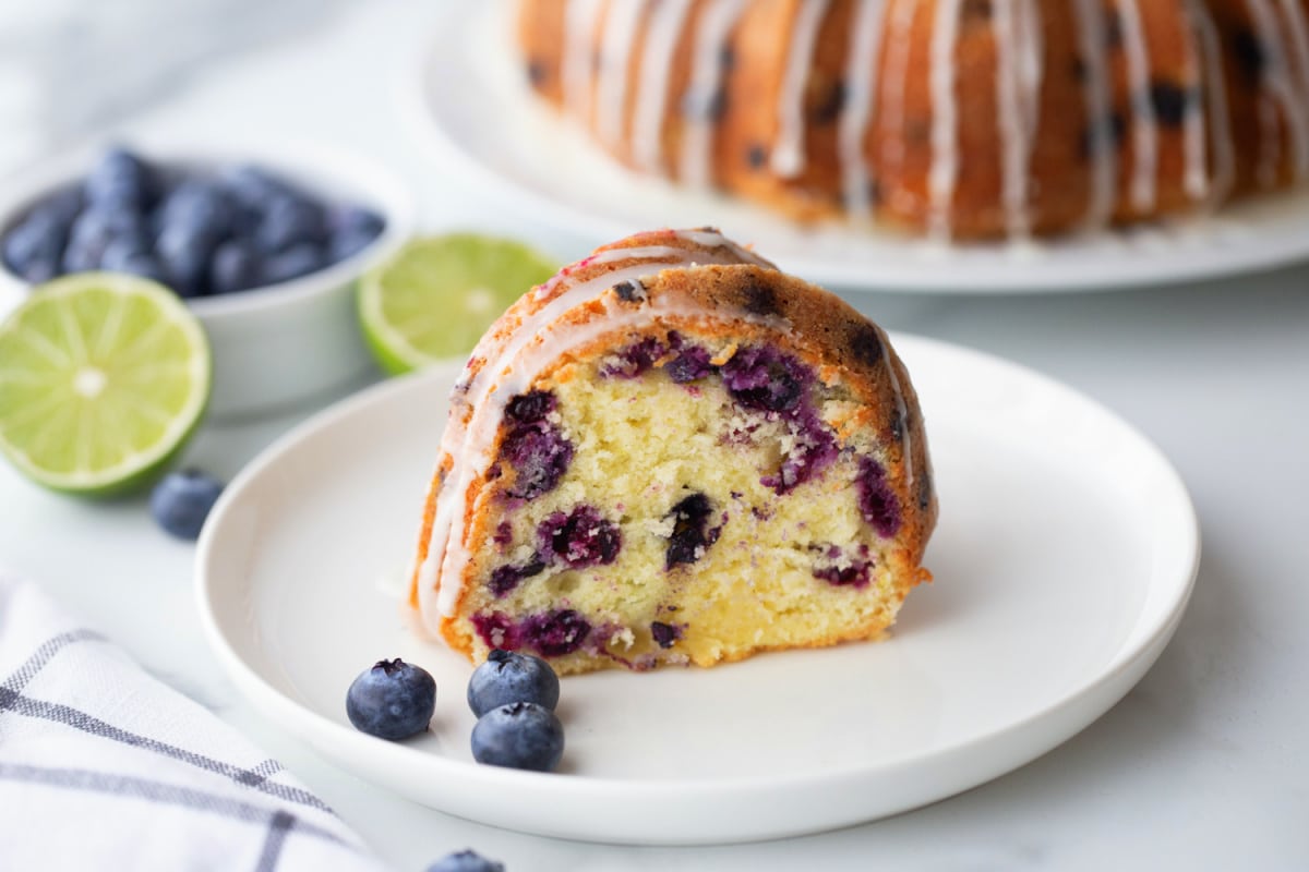 Sliced Blueberry-Lime Pound Cake A single slice of blueberry-lime pound cake on a plate, showing the moist interior and blueberry distribution.