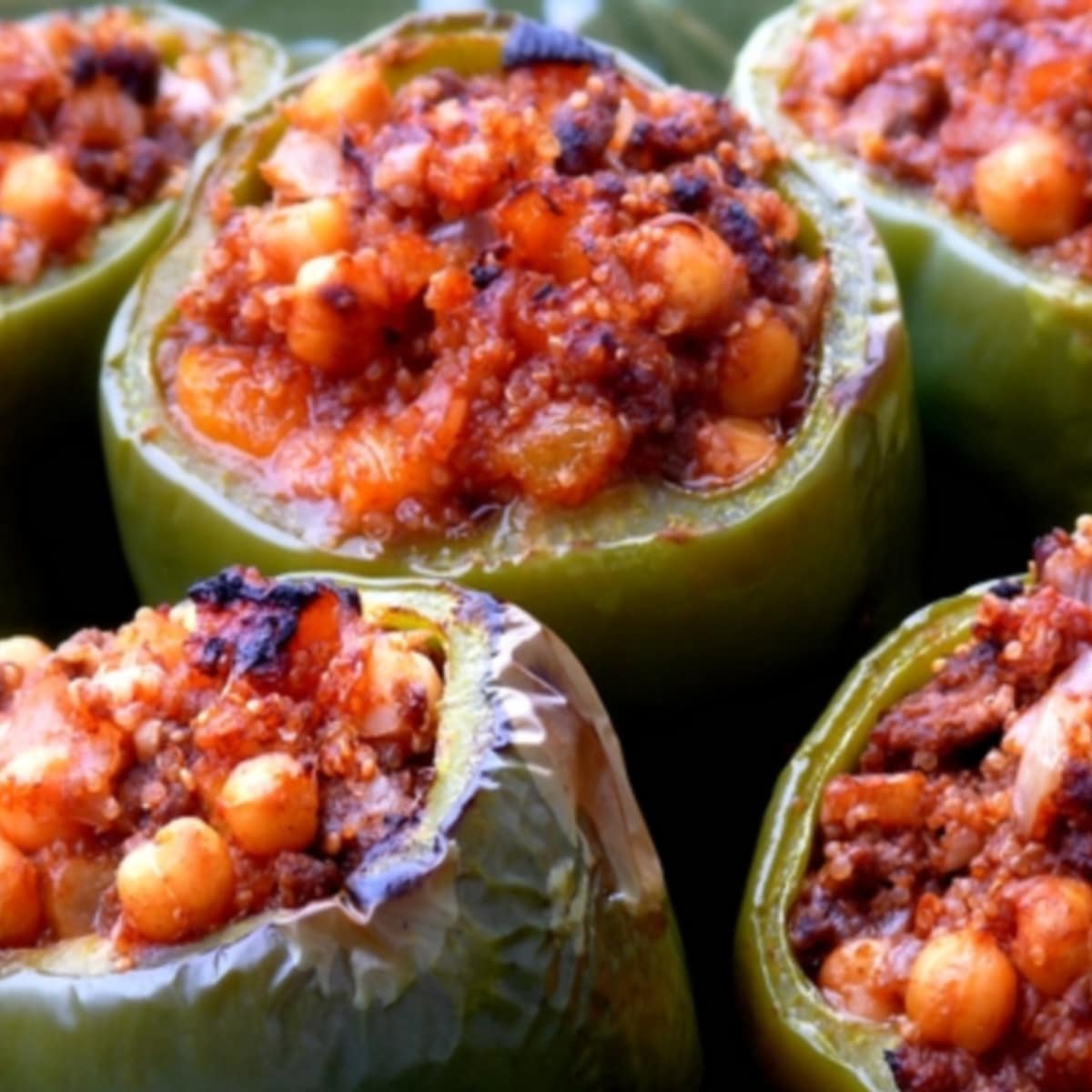 Mediterranean-Style Stuffed Peppers Plated Mediterranean-Style Stuffed Peppers on a white plate, garnished and ready to serve as a healthy, flavorful dinner.