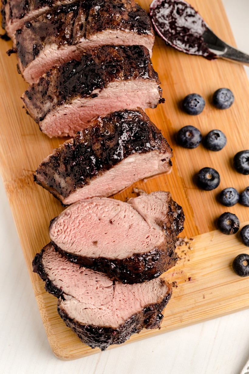 Sliced pork tenderloin with blueberry sauce