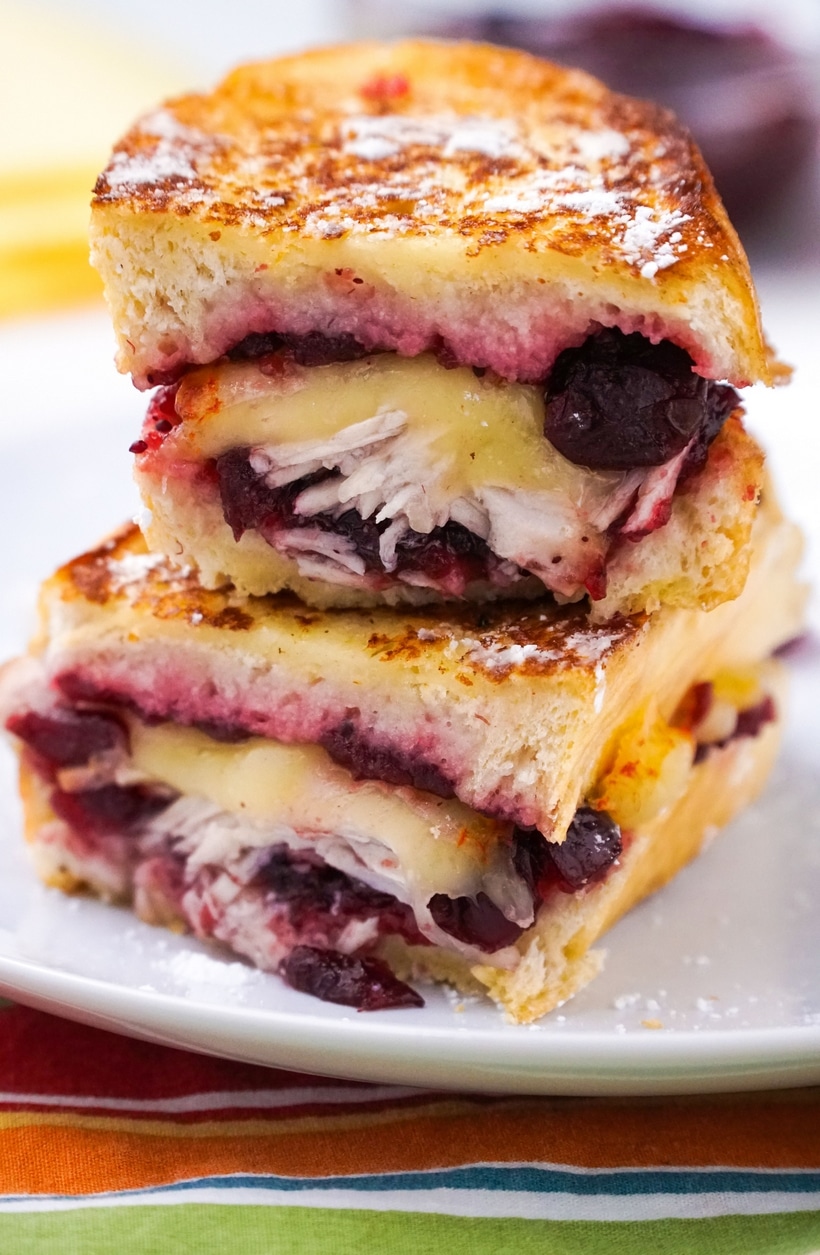 a double stack of sliced Leftover Turkey Monte Cristo Sandwiches Leftover Turkey Monte Cristo Sandwiches sliced in half.