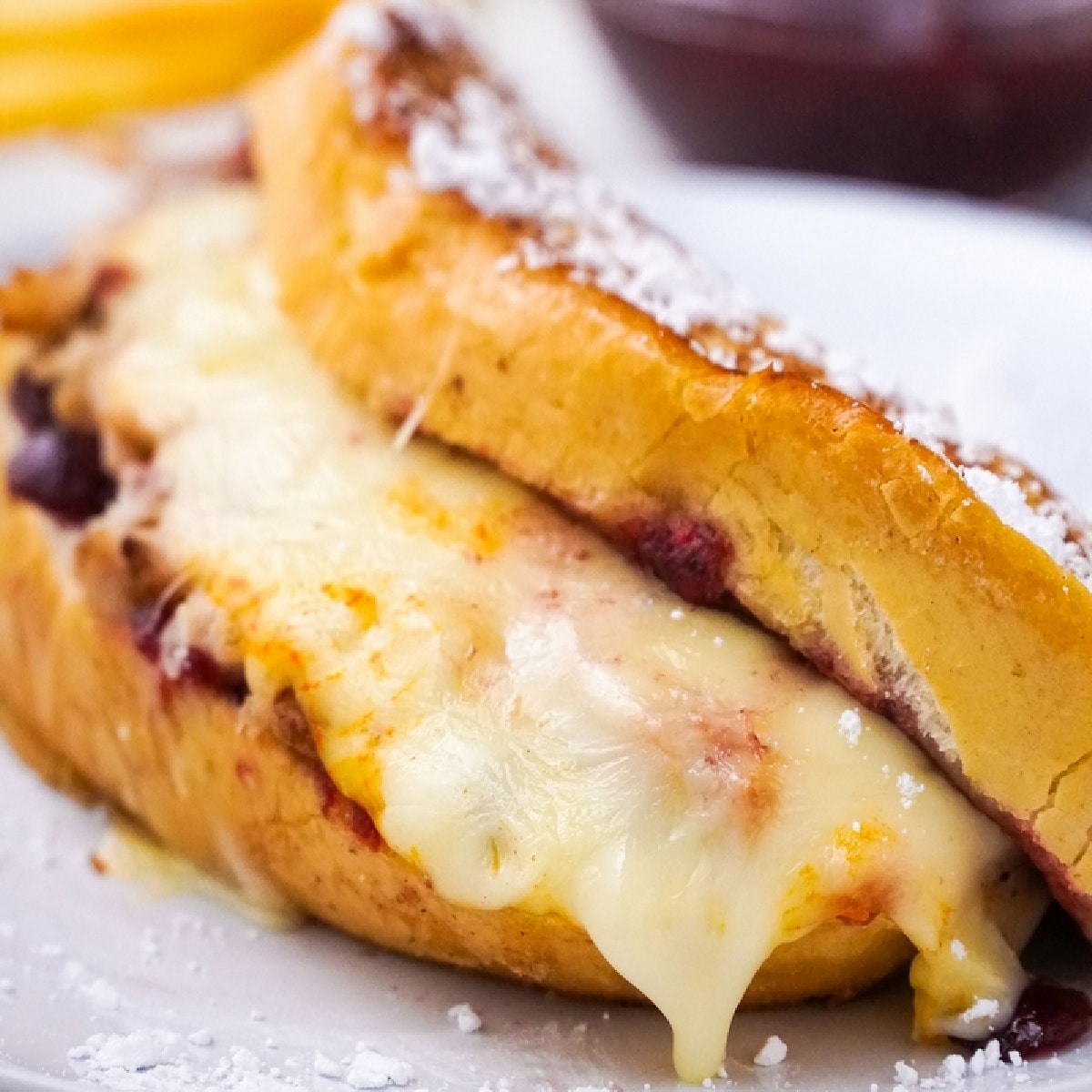 leftover turkey cranberry Monte Cristo sandwiches with melty Muenster cheese leftover turkey cranberry Monte Cristo sandwiches