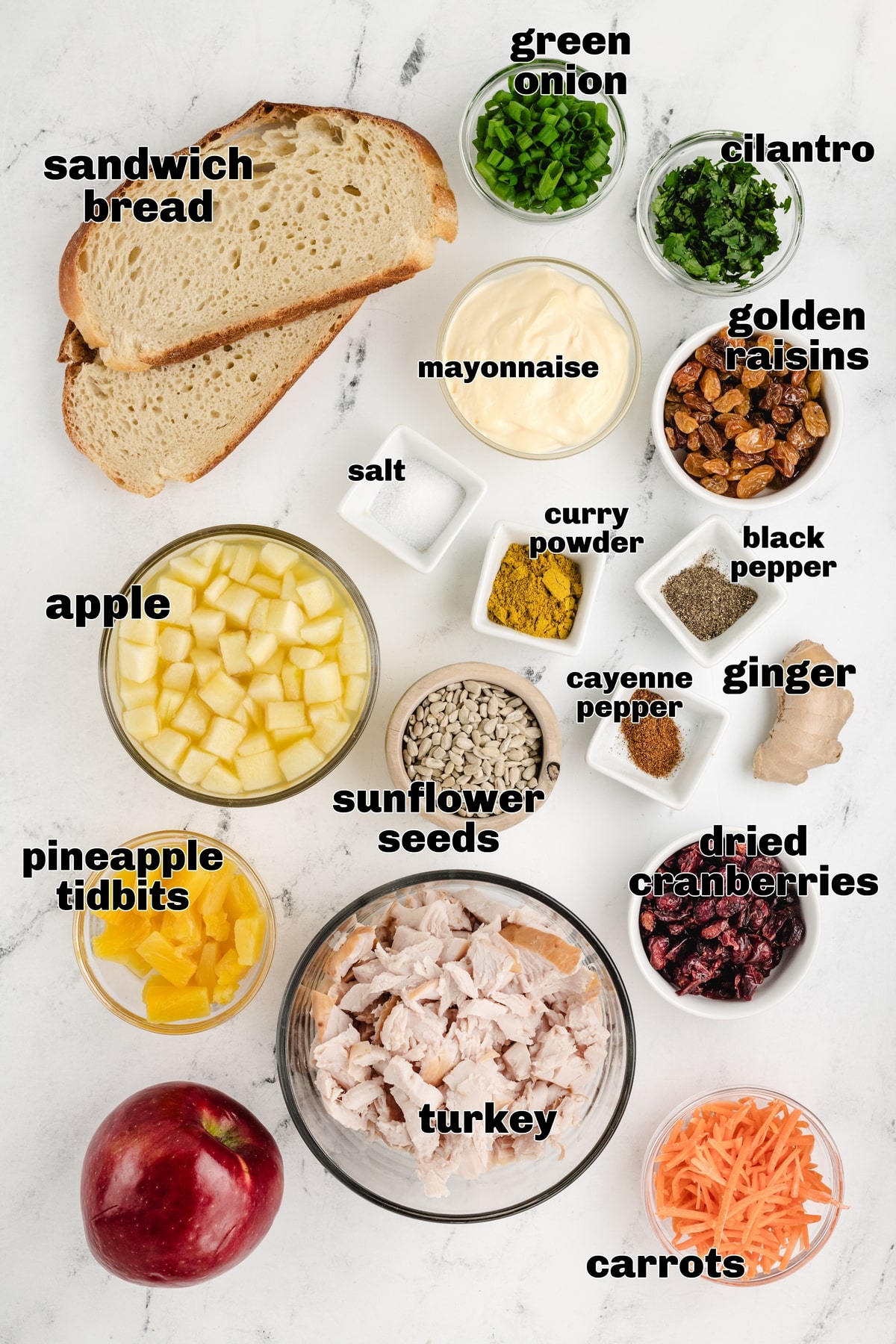 All ingredients for Curried Turkey Salad Sandwiches. Overhead of all curried turkey salad sandwich ingredients.