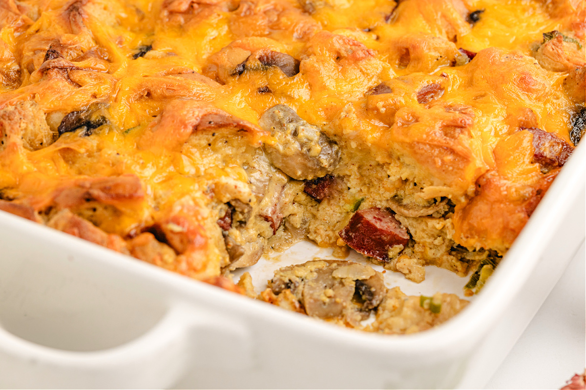 Bagel breakfast casserole fresh from the oven. Baked bagel breakfast casserole with kielbasa, mushrooms, and melted cheddar.