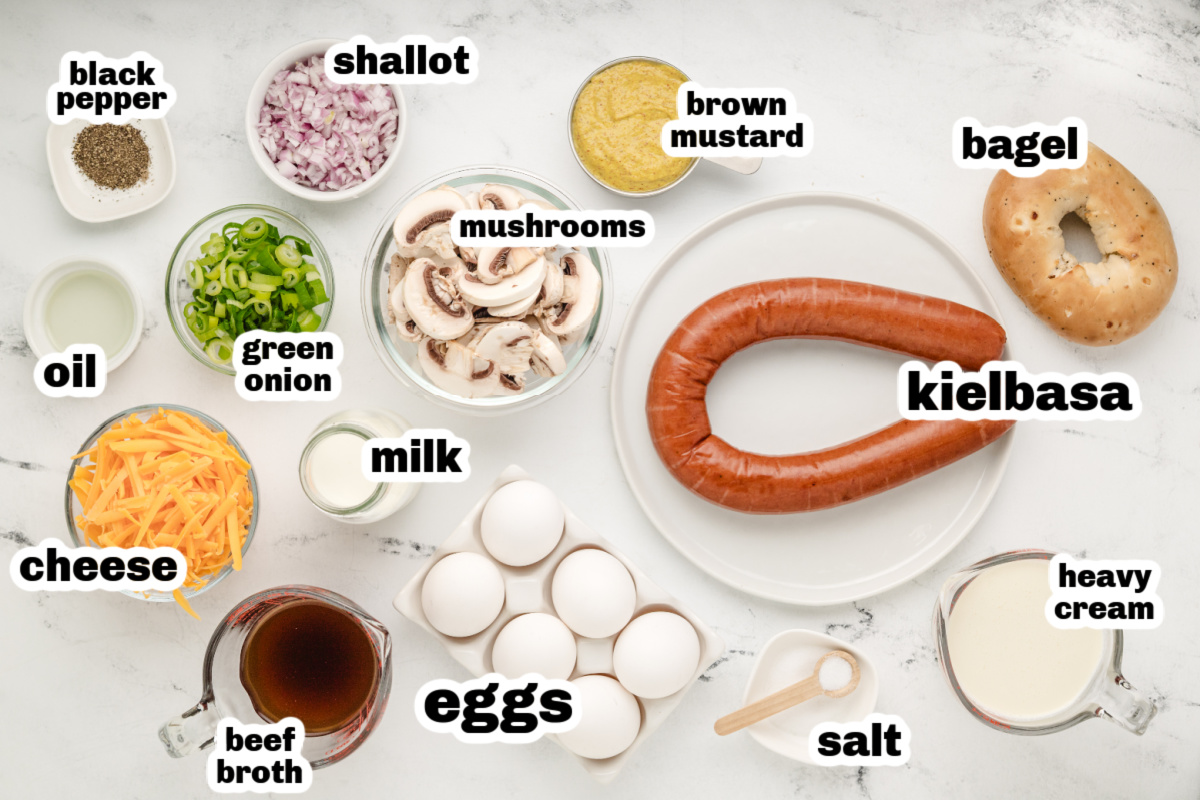 Kielbasa bagel breakfast casserole ingredients ready to prep. Ingredients for bagel breakfast casserole with kielbasa, bagels, eggs, and cheese.