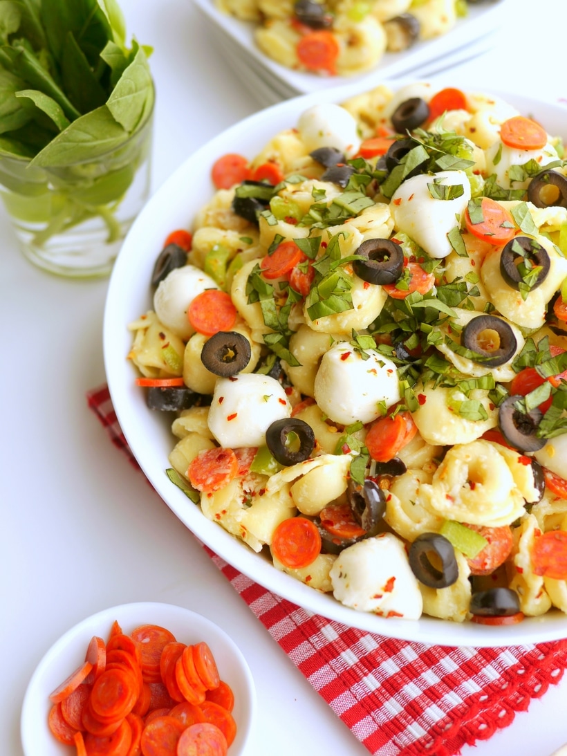 Bursting with bold flavors and with a pizza-inspired twist, this Pepperoni Pasta Salad is the perfect dish for any upcoming get-together. The tender pasta, juicy tomatoes, savory pepperoni, and zesty Italian dressing tie it all together in one delicious pizza pasta salad recipe. pasta salad with pepperoni