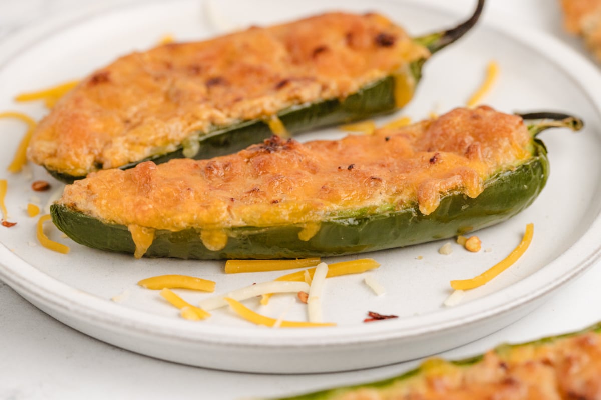 Platter of cheesy stuffed jalapeños, ready to serve as a game day appetizer.