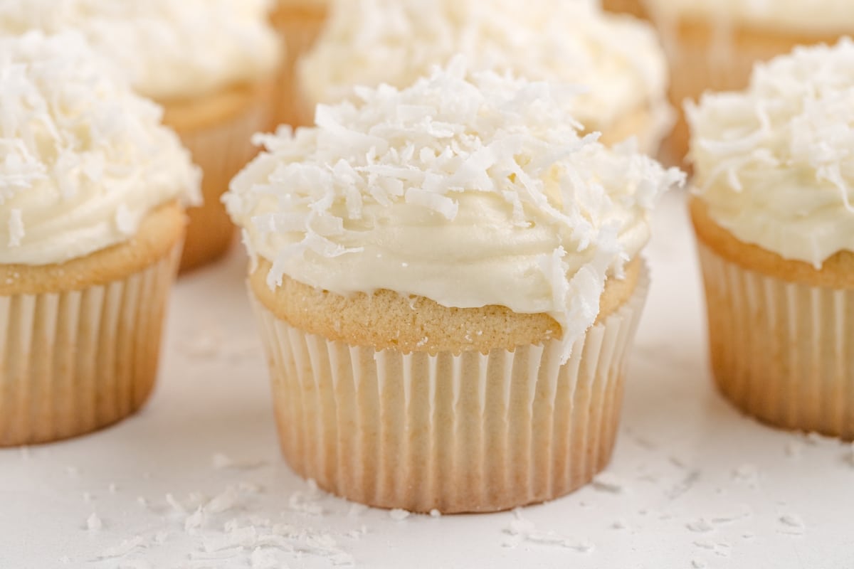 A coconut cupcakes with coconut cream cheese frosting, perfect for any celebration.