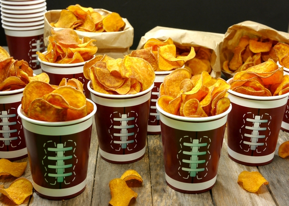 The Best Homemade Sweet Potato Chips filled lots of cups that look like footballs.