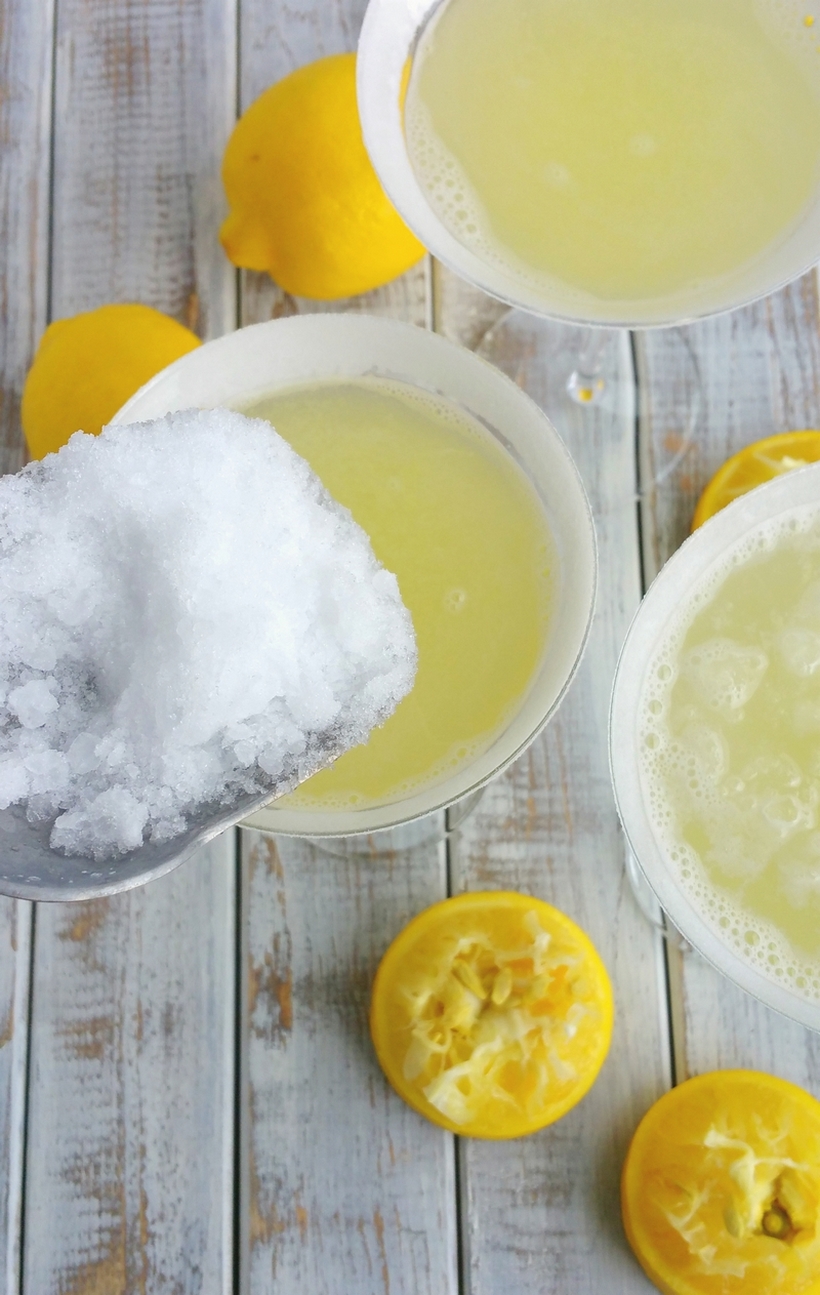The perfect lemon drop martini should be refreshingly tart, not cloyingly sweet. Lucky for you this is The Most Refreshing Lemon Drop Martini! Give it a try soon. The perfect lemon drop martinis with ice being scooped into them.