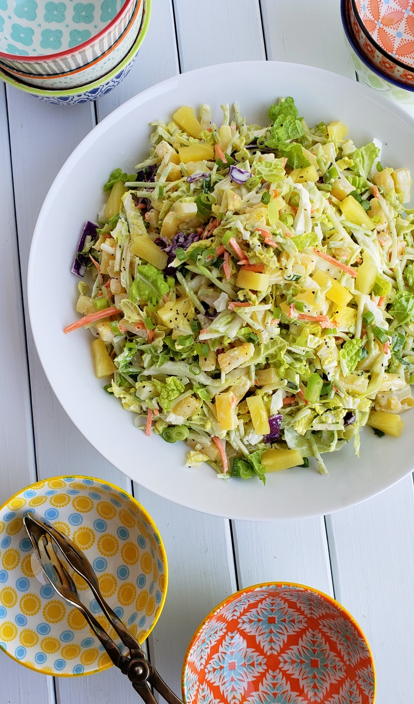 This Easy Pineapple Coleslaw is going to remind you of summer all year long. Enjoy as a side dish or top your favorite chicken burger with this one. coleslaw with pineapple