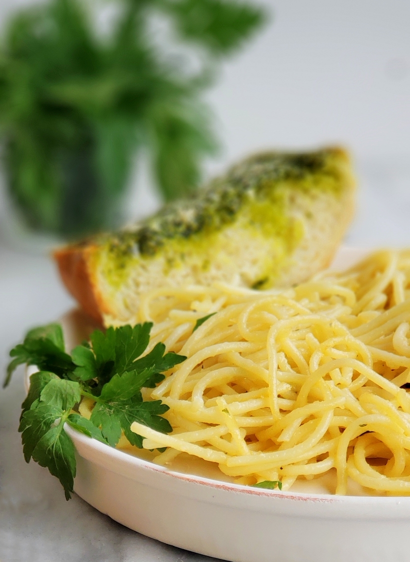 Use up your  leftover parsley with this deliciously, flavorful Garlicky, Cheesy Parsley Bread. It's the perfect side dish for a bowl of pasta. #noblepig #parsley #garlicbread