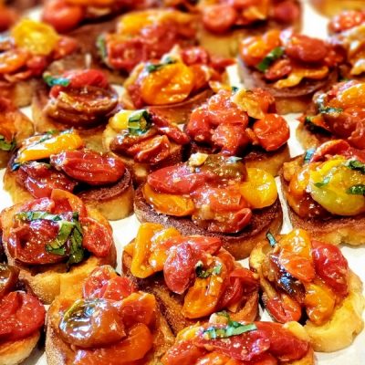 Roasted Garlic Bruschetta on parchment paper.