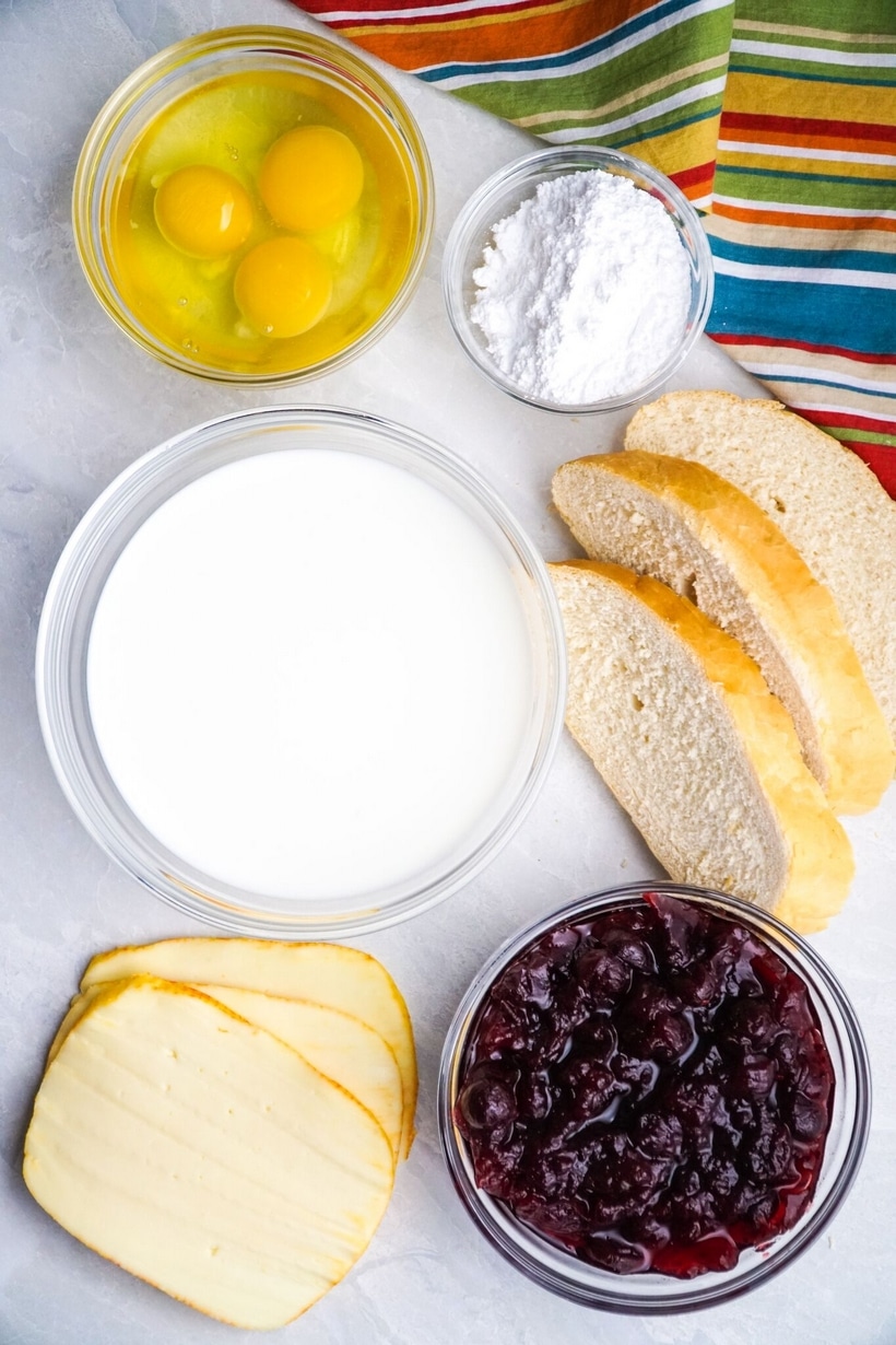 Sandwich ingredients for Leftover Turkey Monte Cristo Sandwich Leftover Turkey Monte Cristo sandwich ingredients on a countertop.