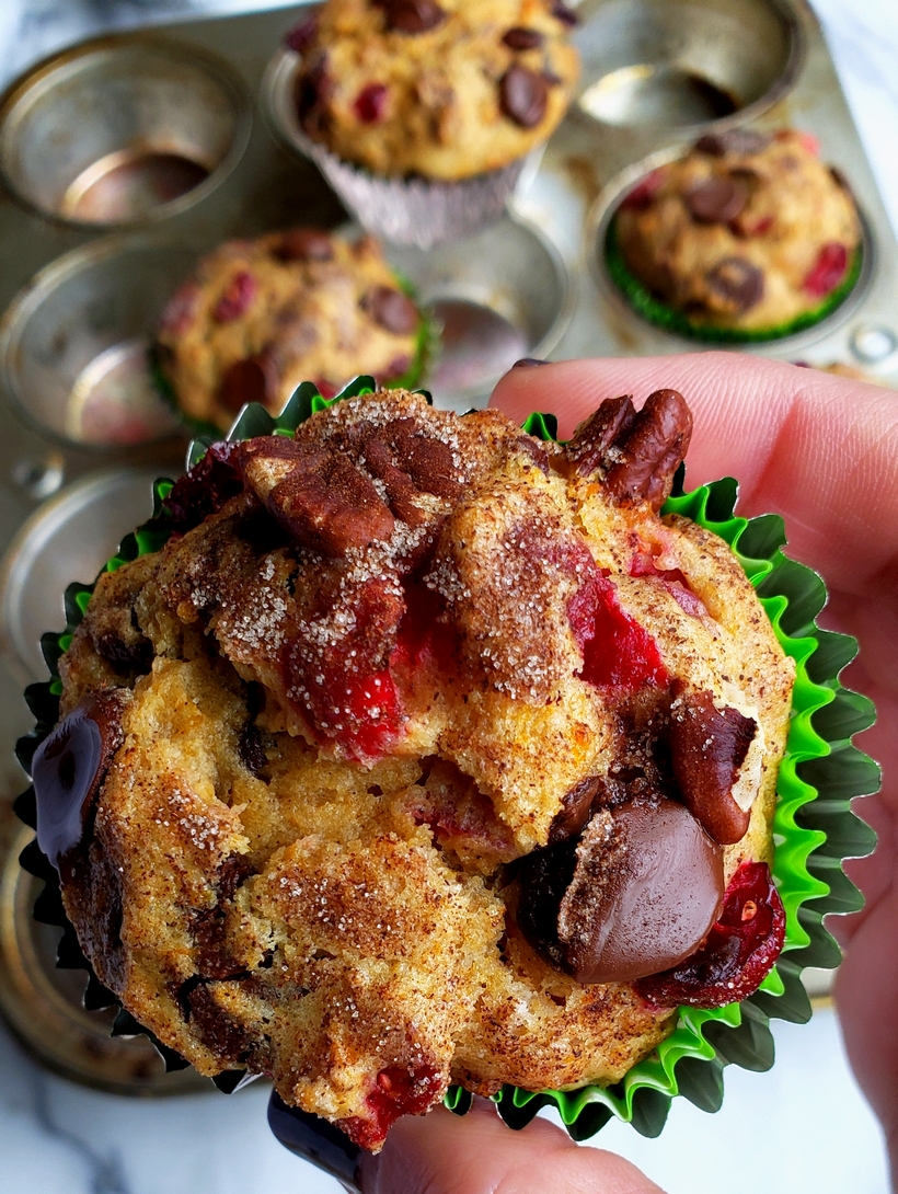 The ingredients are simple on their own, but together these Sweet Potato Cranberry-Chocolate Muffins are a delicious fall symphony. Each flavor compliments and enhances one another making these muffins one of the best tasting bites you’ll enjoy this season. Muffin held in hand