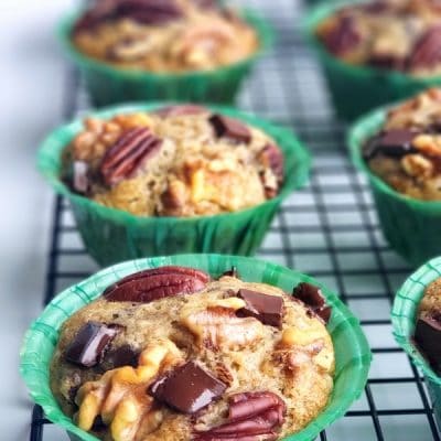 These Eggnog Banana Bread Muffins are tender, delicious and full of pure banana flavor. The eggnog lends a gentle nod to the holidays in a format that is perfect for celebrating Christmas brunch. This holiday breakfast muffin is the perfect cure to hunger while unwrapping those holiday gifts. #noblepig #eggnog #eggnogmuffins #eggnogbananamuffins #holidaybreakfastrecipes #holidaybreakfastideas #christmasbrunch #holidaymuffinrecipe #fluffyeggnogmuffins #christmasbreakfast #muffins #muffinrecipe