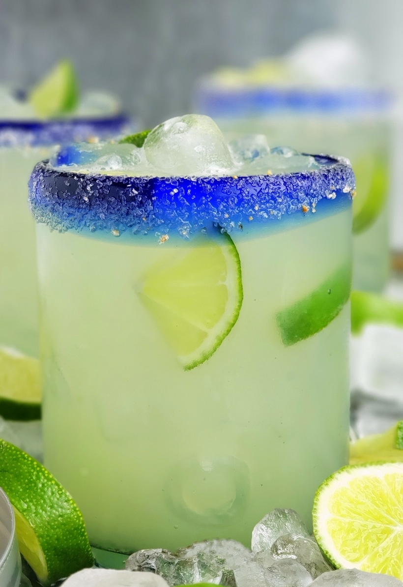 Three ingredients is all you need to make this outstanding margarita with agave as its sweetener. Perfectly balanced and refreshing, this agave margarita recipe will be your new favorite patio drink. Close-up of agave margarita in a glass.