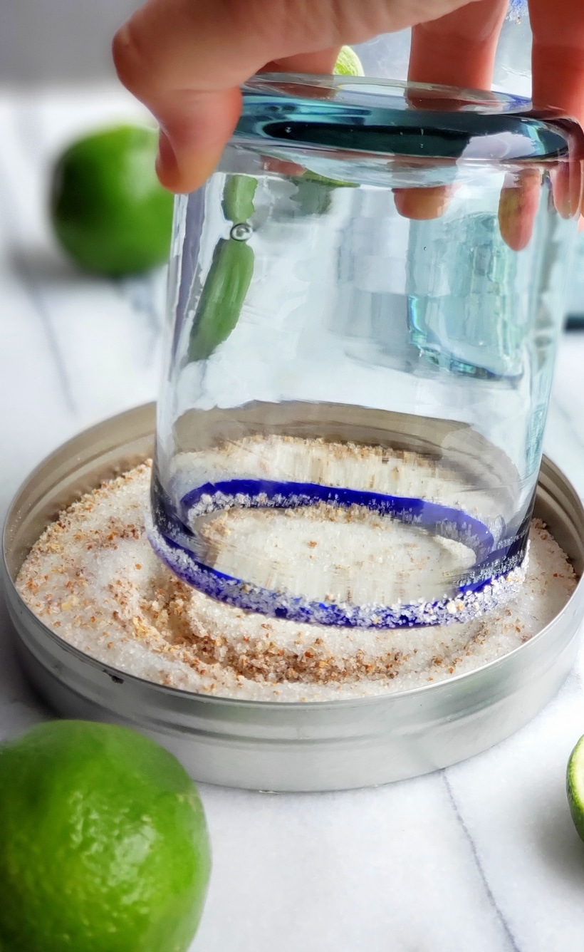Three ingredients is all you need to make this outstanding margarita with agave as its sweetener. Perfectly balanced and refreshing, this agave margarita recipe will be your new favorite patio drink. Margarita glass being dipped in margarita salt.