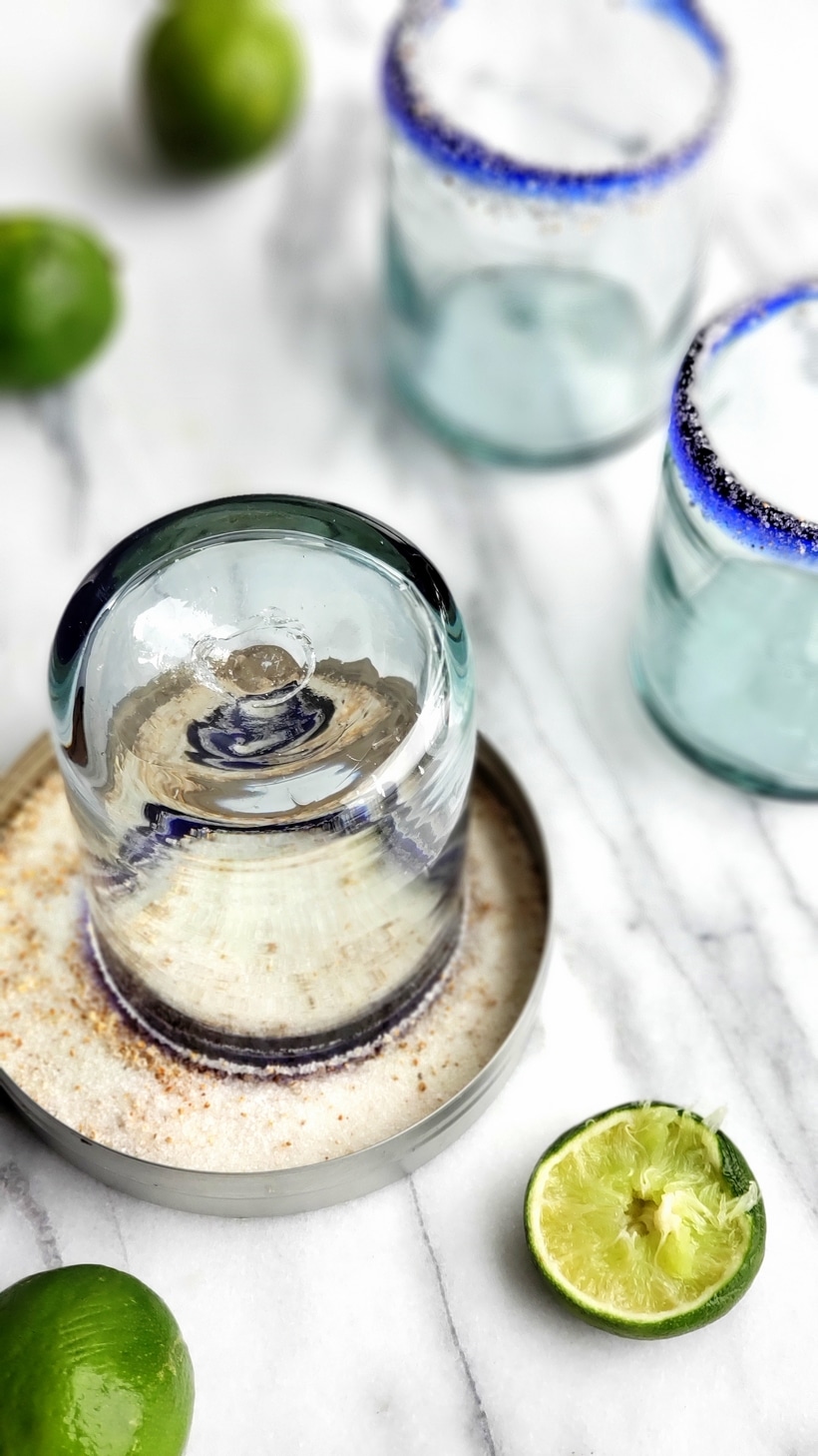 Three ingredients is all you need to make this outstanding margarita with agave as its sweetener. Perfectly balanced and refreshing, this agave margarita recipe will be your new favorite patio drink. Empty margaritas with salted rims and a glass sitting in margarita salt.