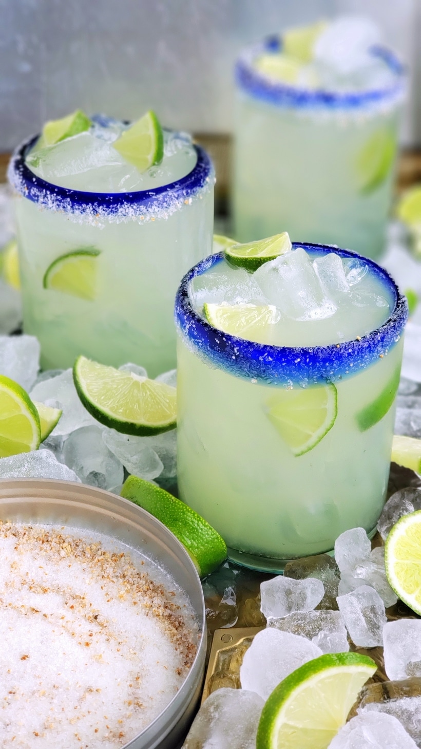 Three ingredients is all you need to make this outstanding margarita with agave as its sweetener. Perfectly balanced and refreshing, this agave margarita recipe will be your new favorite patio drink. Agave margaritas in three glasses.
