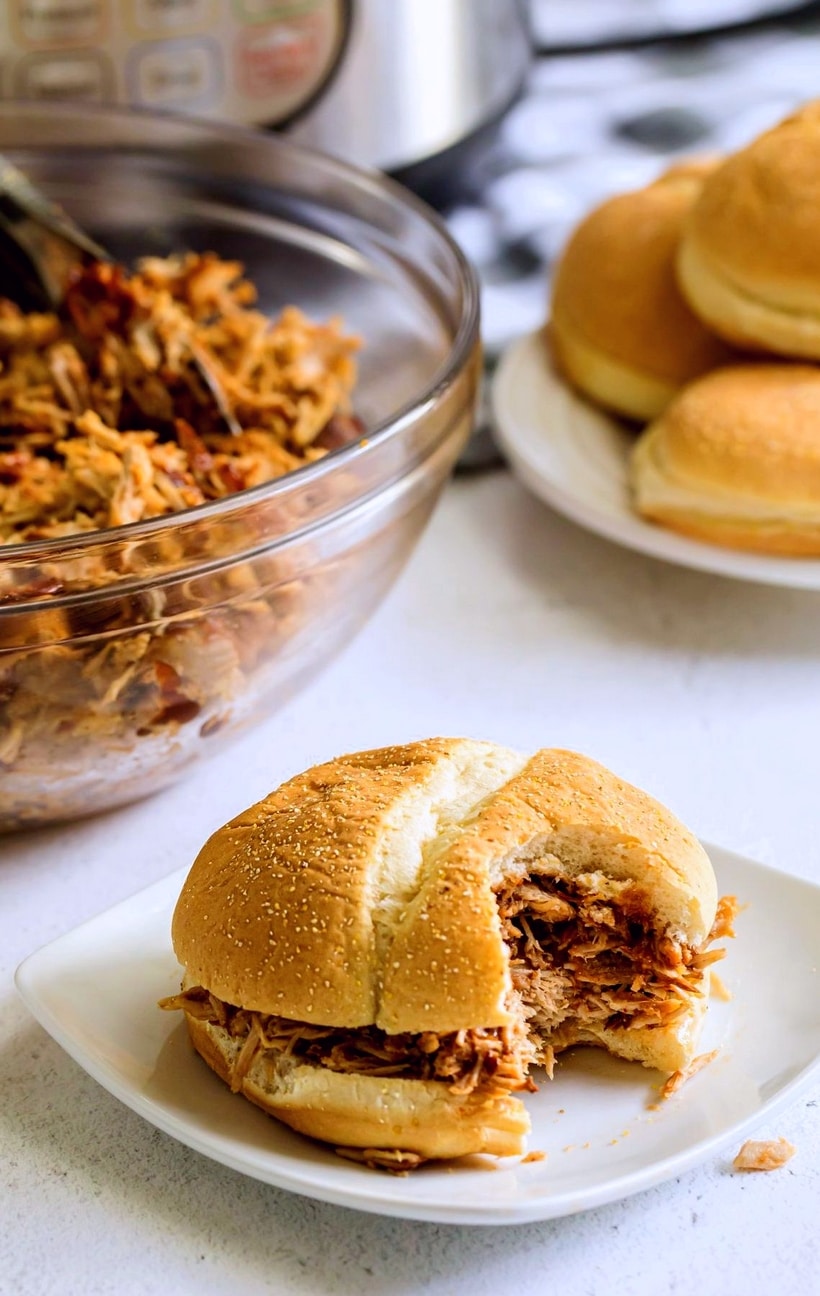 Instant Pot Pulled Pork with barbecue sauce is made to be piled high on your favorite bun. This flavor-packed pulled pork is fall-apart tender and will be ready in no-time for dinner tonight. instant pot smoked pork shoulder picnic