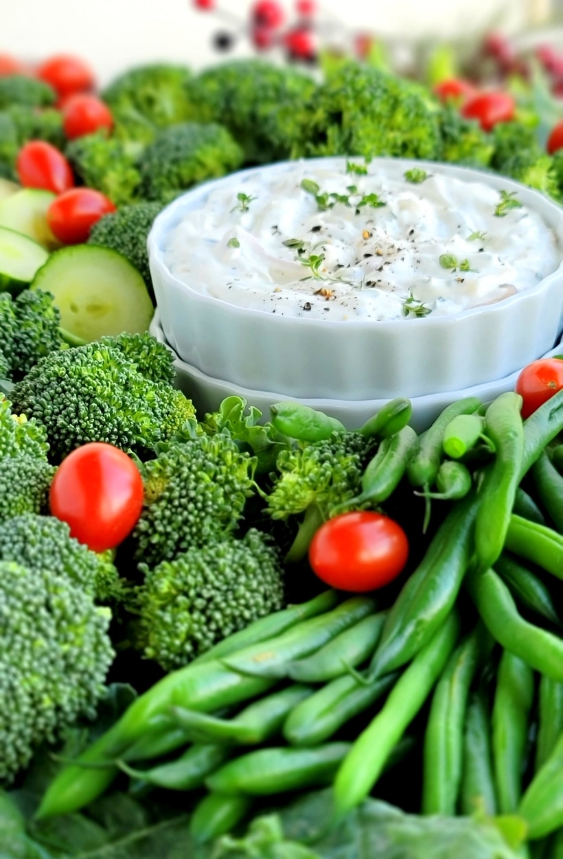 A simple Christmas Wreath Vegetable tray made from your favorite veggies and served with a tasty, addictive onion dip! vegetable tray for the holidays
