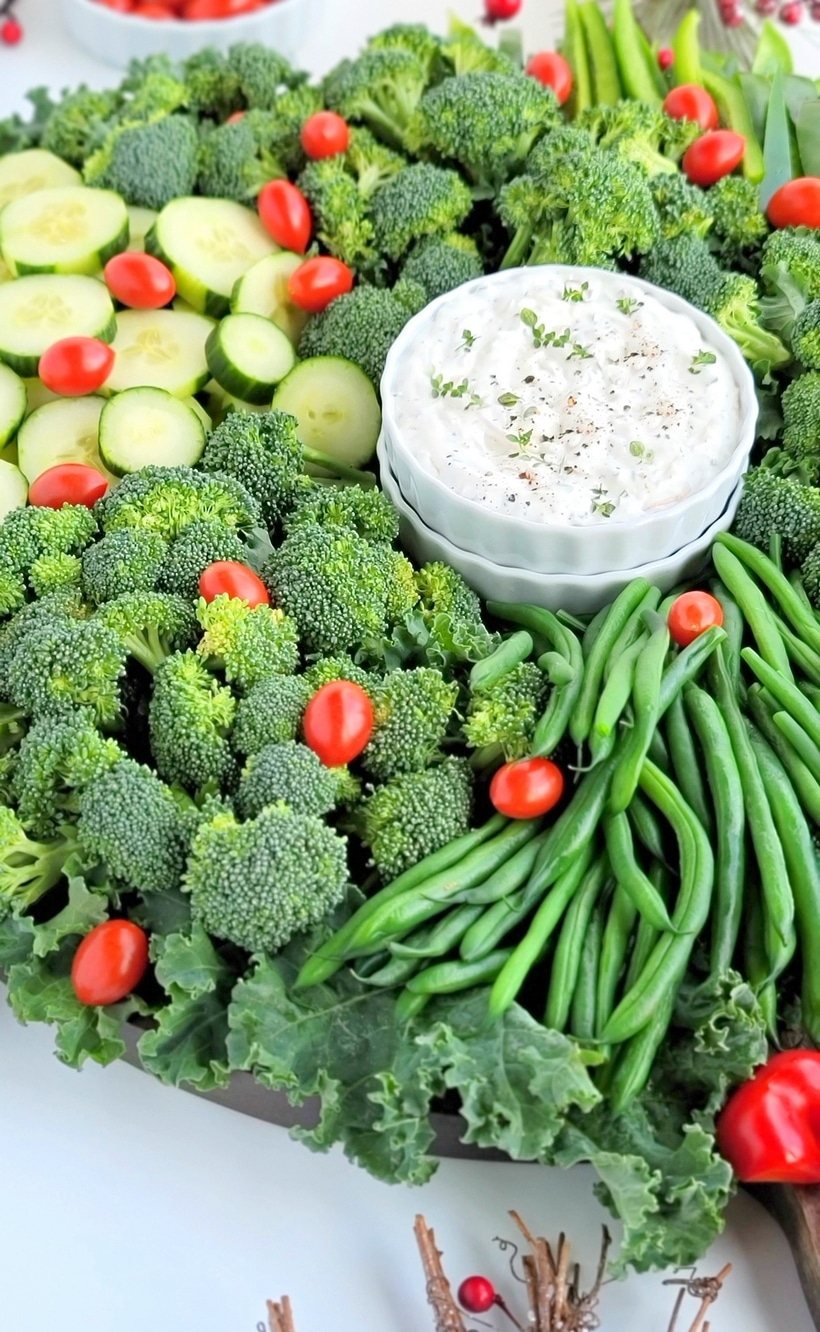 A simple Christmas Wreath Vegetable tray made from your favorite veggies and served with a tasty, addictive onion dip! Christmas wreath veggie tray