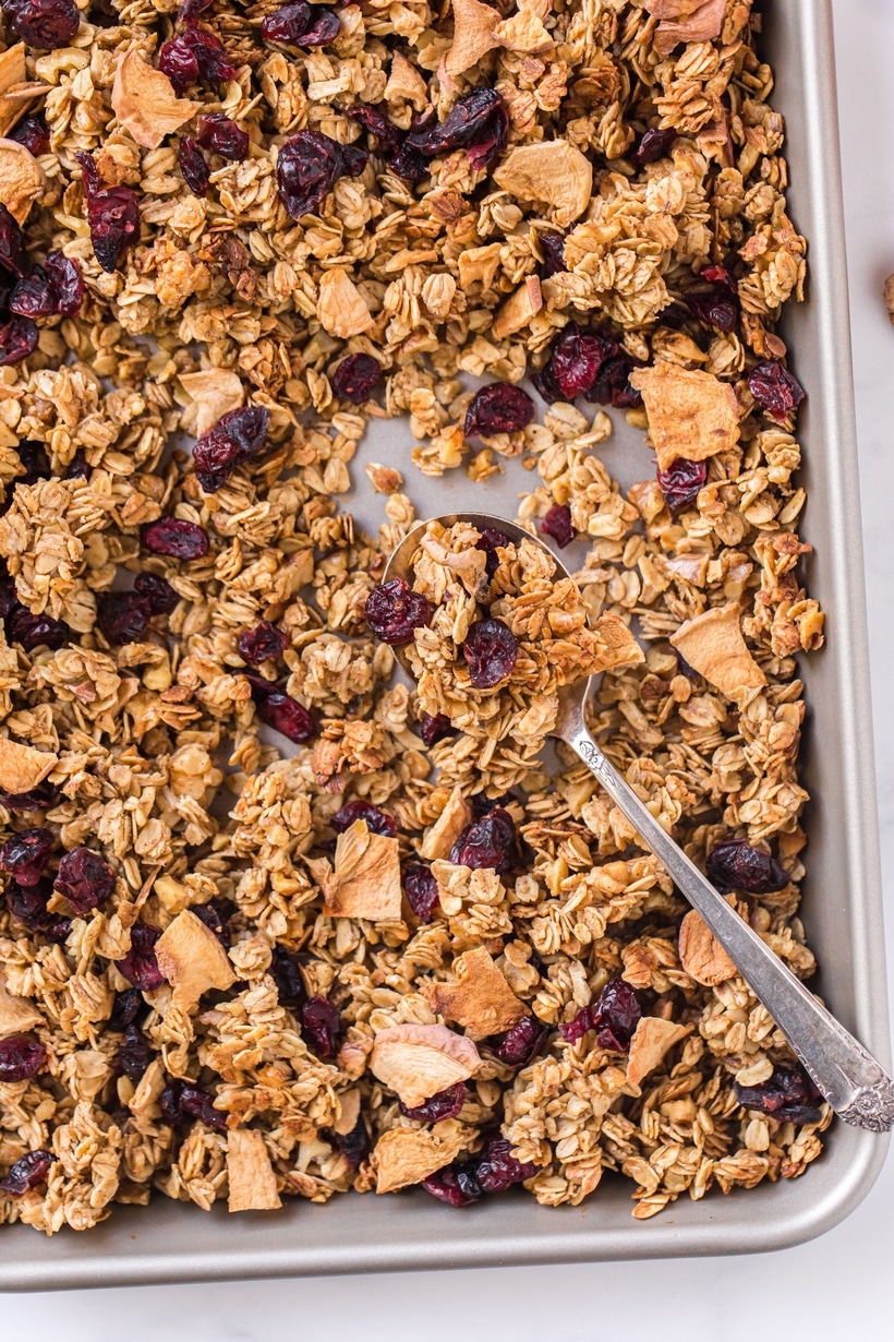 Apple Cinnamon Granola, you'll never buy store-bought granola again! This baked granola is perfect for breakfast or snacking by the handful. Apple Cinnamon Granola